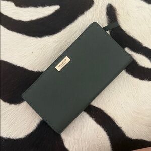 Kate Spade Madison Large Slim Biofold Wallet in the color EVERGREEN.